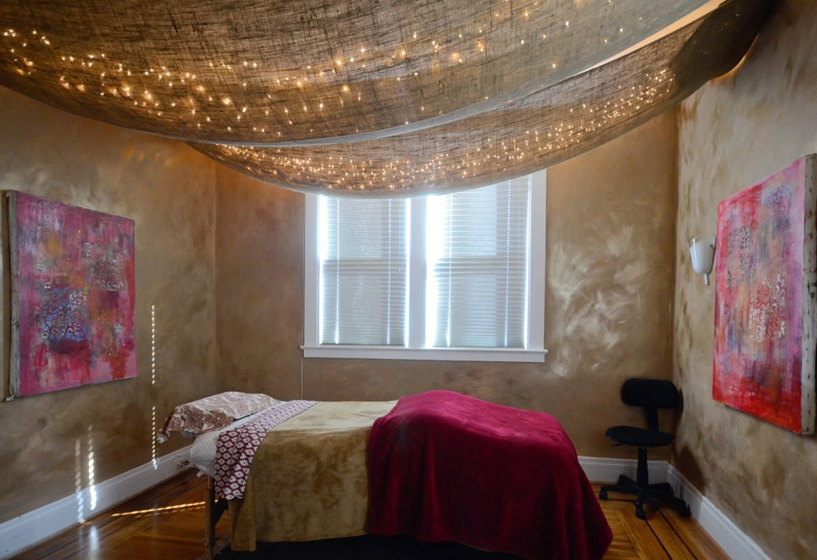 Massage room glowing with fairy lights